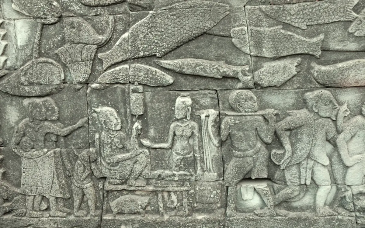 Bas-relief at the Bayon showing a market scene with figures and fish